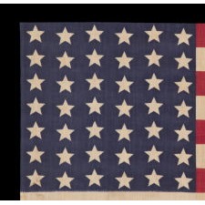 42 STARS IN A WAVE CONFIGURATION OF LINEAL COLUMNS, ON AN ANTIQUE AMERICAN FLAG THAT REFLECTS THE PERIOD OF WASHINGTON STATEHOOD, NEVER AN OFFICIAL STAR COUNT, circa 1889-1890