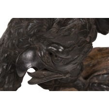EXCEPTIONALLY EARLY AND EXPERTLY DEVELOPED CARVING OF AN EAGLE, PERCHED ON A BED OF CLOUDS, CIRCA 1785-1820, AMERICAN