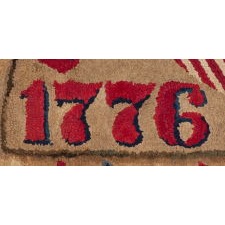 WOOL HOOKED RUG, MADE FOR THE 1876 CENTENNIAL OF AMERICAN INDEPENDENCE, WITH STARS AND A PATRIOTIC SHIELD