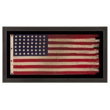AMERICAN FLAG WITH 48 STARS, A U.S. NAVY SMALL BOAT ENSIGN FROM A WWII SUBMARINE, WITH ENDEARING WEAR FROM LONG-TERM USE; THE FLAG MADE IN JANUARY, 1944 AT MARE ISLAND, CALIFORNIA; BROUGHT HOME BY GUNNER’S MATE 2ND CLASS, JAY J. BURKINS OF LANCASTER COUNTY, PENNSYLVANIA