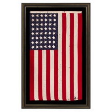 ANTIQUE AMERICAN FLAG WITH 48 STARS, A U.S. NAVY SMALL BOAT ENSIGN, MADE DURING WWII, IN DECEMBER OF 1943, AT MARE ISLAND, CALIFORNIA, HEADQUARTERS OF THE PACIFIC FLEET, SIGNED & DATED