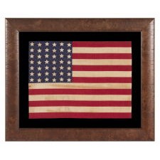 42 STARS ON AN ANTIQUE AMERICAN FLAG WITH A WAVE CONFIGURATION OF LINEAL COLUMNS, REFLECTS THE ADDITION OF WASHINGTON STATE, MONTANA, AND THE DAKOTAS, NEVER AN OFFICIAL STAR COUNT, circa 1889-1890