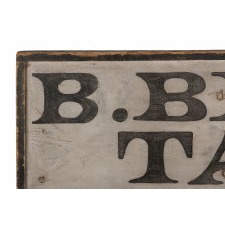 EARLY AMERICAN TRADE SIGN: “B. BRISCOE, TAILOR,” circa 1810-1850, WITH A BACKWARDS “S” AND EXTRAORDINARY SURFACE