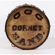 PATRIOTIC, PAINT-DECORATED BASE DRUM, WITH EXTRAORDINARY COLOR AND BOLD IMAGERY THAT INCLUDES AN EAGLE AND CROSSED FLAGS; FROM THE GENESEO CORONET BAND [LATER C.C.G. CORONET BAND], ACTIVE AT LEAST 1862 – 1901