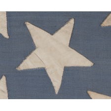 38 STAR ANTIQUE AMERICAN FLAG WITH A STARBURST CROSS ARRANGEMENT ON A PRUSSIAN BLUE CANTON, ONE OF THE MOST DYNAMIC CONFIGURATIONS THAT EXISTS IN FLAG COLLECTING, COLORADO STATEHOOD, 1876-1889