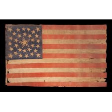 31 STARS ON AN ANTIQUE AMERICAN FLAG WITH ITS STARS CONFIGURED IN A MEDALLION PATTERN THAT FEATURES A LARGE, HALOED CENTER STAR; REFLECTS THE PERIOD WHEN CALIFORNIA WAS THE MOST RECENT STATE TO JOIN THE UNION, 1850-1858