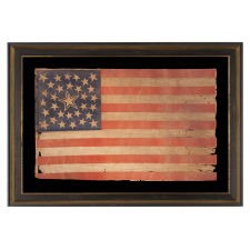 31 STARS ON AN ANTIQUE AMERICAN FLAG WITH ITS STARS CONFIGURED IN A MEDALLION PATTERN THAT FEATURES A LARGE, HALOED CENTER STAR; REFLECTS THE PERIOD WHEN CALIFORNIA WAS THE MOST RECENT STATE TO JOIN THE UNION, 1850-1858