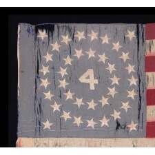 RARE AND BEAUTIFUL 38 STAR ANTIQUE AMERICAN FLAG, AN INDIAN WARS PERIOD FLANK GUIDON OF THE 4th U.S. INFANTRY, WITH A MEDALLION CONFIGURATION SURROUNDING THE NUMERAL “4,” AND EXTRAORDINARY PRESENTATION FROM LEGITIMATE USE; REFLECTS THE PERIOD WHEN COLORADO WAS THE MOST RECENT STATE TO JOIN THE UNION, circa 1876-1889