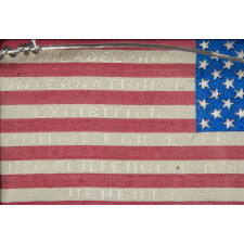 FRENCH-DESIGNED AMERICAN FLAG, WOVEN SILK WITH TEXT ON BOTH SIDES, PRODUCED FOR THE 100TH ANNIVERSARY OF AMERICAN INDEPENDENCE; LIKELY MADE IN PHILADELPHIA AT THE 1876 CENTENNIAL INTERNATIONAL EXPOSITION
