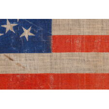 38 STAR ANTIQUE AMERICAN FLAG WITH AN OFF-BALANCE MEDALLION CONFIGURATION, ON A BRILLIANT BLUE CANTON, MADE IN THE PERIOD WHEN COLORADO WAS THE MOST RECENT STATE TO JOIN THE UNION, 1876-1889