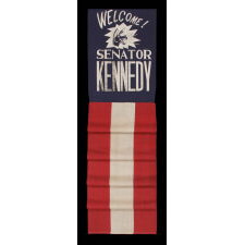 GRAPHIC BANNER WELCOMING JOHN F. KENNEDY AS JUNIOR SENATOR FROM MASSACHUSETTS, WITH NEIGHING DEMOCRAT DONKEY AND GLITTERED LETTERING, 1953-1960, SINGULAR AMONG KNOWN OBJECTS; SAID TO HAVE BEEN HUNG FROM A BRIDGE IN TROY, NEW YORK, TO WELCOME HIM TO THE CITY, DURING HIS 1960 CAMPAIGN FOR THE WHITE HOUSE