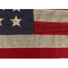 44 STAR ANTIQUE AMERICAN FLAG, WITH AN EXTREMELY RARE LINEAL ARRANGEMENT OF STARS IN ROWS OF 9-9-9-9-8, A ROPE HOIST, AN ELONGATED OVERALL PROFILE, AND AN ELONGATED CANTON; REFLECTS WYOMING STATEHOOD, 1890-1896