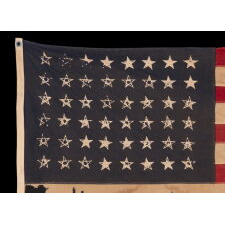 48 STAR FLAG OF THE WWII ERA, WITH ATTRACTIVE WEAR FROM BEING EXTENSIVELY FLOWN, MADE BY THE ANNIN COMPANY OF NEW YORK & NEW JERSEY