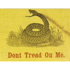ONE OF THE TWO EARLIEST KNOWN FLAGS IN THE DESIGN PRESENTED BY CHRISTOPHER GADSDEN OF SOUTH CAROLINA, FORMER MEMBER OF THE SONS OF LIBERTY, DELEGATE TO THE CONTINANTAL CONGRESS, AND CHAIR OF THE MARINE COMMITTEE, SUGGESTING IT BECOME THE “STANDARD OF THE COMMANDER IN CHIEF OF THE CONTINENTAL U.S. NAVY,” BETTER KNOWN AS THE "GADSDEN FLAG;" PRINTED ON GLAZED, SAFFRON YELLOW COTTON, ATTRIBUTED TO PRINTER JOHN M. EASTERBY OF NEW YORK AND SOUTH CAROLINA, circa 1860 (POSSIBLY PRIOR)