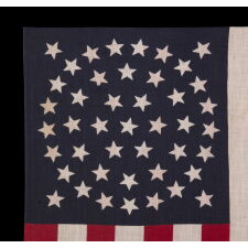 44 STAR ANTIQUE AMERICAN PARADE FLAG WITH A TRIPLE WREATH FORM OF THE MEDALLION CONFIGURATION, RARE IN THIS PERIOD WITH A CIRCULAR STAR ARRANGEMENT, 1890-1896, REFLECTS THE ADDITION OF WYOMING TO THE UNION