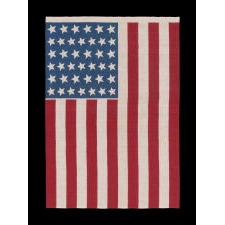 39 STARS IN TWO SIZES, ALTERNATING FROM ONE COLUMN TO THE NEXT, ON AN ANTIQUE AMERICAN PARADE FLAG DATING TO THE 1876 CENTENNIAL, NEVER AN OFFICIAL STAR COUNT, REFLECTS THE ANTICIPATED ARRIVAL OF COLORADO AND THE DAKOTA TERRITORY