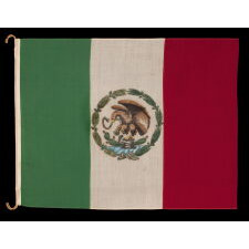 MEXICAN NATIONAL FLAG IN THE DESIGN USED BY REVOLUTIONARIES FROM 1917 - 1934, THE FIRST PERIOD IN WHICH THE EAGLE WAS ILLUSTRATED IN SIDE VIEW; MADE OF GABARDINE WOOL AND WOOL BUNTING, WITH RICH COLORS AND A HAND-PAINTED DEVICE, USED IN THE LATTER YEARS OF THE ERA OF PONCHO VILLA (b. 1878, d. 1923)