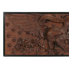 EXPERTLY CARVED AMERICAN FEDERAL EAGLE, SURROUNDED BY 22 STARS, (PROBABLY A SOUTHERN-EXCLUSIONARY STAR COUNT,) WITH THE BACKGROUND EXECUTED IN UNUSUALLY DEEP RELIEF; THE HEAD DIRECTED TOWARDS A CLUSTER OF ARROWS AND A FLAG WITH ITS SPEAR SHAPED FINIAL OUTWARD AND UPWARD; MADE FROM A THICK PLANK OF SOLID MAHOGANY, LIKELY CIVIL WAR PERIOD, circa 1861-1865