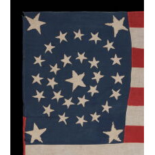 31 STARS IN A MEDALLION PATTERN ON AN ELONGATED, HOMEMADE, ANTIQUE AMERICAN FLAG WITH A VERTICALLY-ORIENTED CANTON AND EXCEPTIONAL FOLK QUALITIES, PRE-CIVIL WAR, CALIFORNIA STATEHOOD, 1850-1858