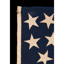 ENTIRELY HAND-SEWN, 38 STAR, ANTIQUE AMERICAN FLAG OF THE INDIAN WARS PERIOD, WITH A SQUARISH PROFILE AND A CANTON THAT IS TALLER THAN IT IS WIDE, SIMILAR TO U.S. INFANTRY AND ARTILLERY BATTLE FLAGS, AND WITH AN ESPECIALLY GRAPHIC PRESENTATIONOF STARS; MADE IN THE ERA WHEN COLORADO WAS THE MOST RECENT STATE TO JOIN THE UNION, 1876-1889