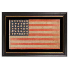 38 STAR ANTIQUE AMERICAN PARADE FLAG WITH JUSTIFIED ROWS OF 7-6-6-6-6-7 AND SCATTERED STAR ORIENTATION, MADE DURING THE PERIOD WHEN COLORADO WAS THE MOST RECENT STATE TO JOIN THE UNION, 1876-1889
