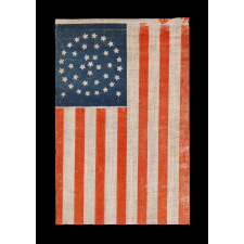 38 STARS IN A TRIPLE WREATH STYLE MEDALLION CONFIGURATION, WITH 2 OUTLIERS, ON ANTIQUE AMERICAN PARADE FLAG WITH BEAUTIFUL COLOR, MADE IN THE ERA WHEN COLORADO WAS THE MOST RECENT STATE TO JOIN THE UNION, 1876-1889
