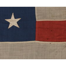 13 STAR ANTIQUE AMERICAN FLAG, MADE BETWEEN THE 1876 CENTENNIAL AND THE LAST DECADE OF THE 19TH CENTURY, WITH A 3-2-3-2-3 CONFIGURATION AND IN AN UNUSUALLY LARGE SCALE FOR THE TIME PERIOD AMONG FLAGS IN THIS STAR COUNT