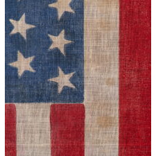44 TUMBLING STARS IN AN HOURGLASS PATTERN, ON AN ANTIQUE AMERICAN FLAG WITH A STRIKING, BRIGHT BLUE CANTON AND SCARLET STRIPES, REFLECTS WYOMING STATEHOOD, circa 1890-1896