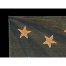 HOMEMADE, 13 STAR, ANTIQUE AMERICAN FLAG WITH A 3-2-3-2-3 STAR CONFIGURATION AND EXTREMELY UNUSUAL CONSTRUCTION, PROBABLY MADE FOR THE 1876 CENTENNIAL OF AMERICAN INDEPENDENCE
