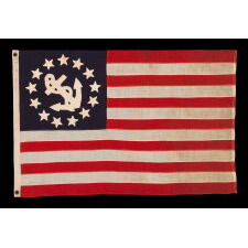 ANTIQUE AMERICAN PRIVATE YACHT ENSIGN WITH 13 SINGLE-APPLIQUÉD, HAND-SEWN STARS & CANTED ANCHOR, A BEAUTIFUL EXAMPLE, MADE BY ANNIN IN NEW YORK CITY, CIRCA 1865-1885