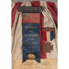 CIVIL WAR PERIOD APRON, MADE IN CAMBRIDGE, OHIO IN 1861 BY 12-YEAR-OLD LAURA HAYNES, WORN BY HER AT BENEFITS FOR THE U.S. SANITARY COMMISSION, PREDECESSOR OF THE RED CROSS, THAT STAFFED, FUNDED, AND MODERNIZED CIVIL WAR HOSPITALS
