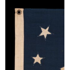 OUTSTANDING, 13 STAR, ANTIQUE AMERICAN PRIVATE YACHT ENSIGN WITH GREAT FOLK QUALITIES THAT INCLUDE AN UNUSUALLY WIDE ANCHOR AND A DECIDEDLY LOPSIDED RING OF 13 STARS; MADE DURING THE 2ND HALF OF THE 19TH CENTURY; ITS DEVICE HAND-SEWN AND SINGLE-APPLIQUÉD
