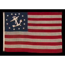 OUTSTANDING, 13 STAR, ANTIQUE AMERICAN PRIVATE YACHT ENSIGN WITH GREAT FOLK QUALITIES THAT INCLUDE AN UNUSUALLY WIDE ANCHOR AND A DECIDEDLY LOPSIDED RING OF 13 STARS; MADE DURING THE 2ND HALF OF THE 19TH CENTURY; ITS DEVICE HAND-SEWN AND SINGLE-APPLIQUÉD