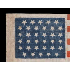 34 STARS IN A LINEAL ARRANGEMENT THAT RESULTS IN A CONFIGURATION THAT I HAVE TERMED "GLOBAL ROWS," ON AN ANTIQUE AMERICAN FLAG MADE DURING THE OPENING TWO YEARS OF THE CIVIL WAR, 1861-63, KANSAS STATEHOOD
