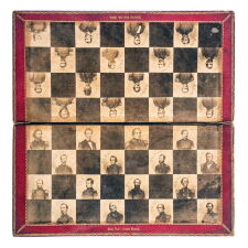 INCREDIBLY RARE, CIVIL WAR PERIOD CHESS SET WITH THE BOARD FEATURING ALBUMEN PHOTOS OF ABRAHAM LINCOLN & A CONTINGENT OF UNION ARMY GENERALS, PATENTED IN 1862 BY WALTER S. HILL & SAMUEL T. REED OF NEW YORK CITY, WITH EXTREMELY LARGE PLAYING PIECES MADE OF HAND-CARVED BONE THAT REMARKABLY DISASSEMBLE FOR EASE OF CARRYING IN THE FIELD
