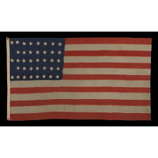 38 HAND-SEWN STARS IN A "NOTCHED" PATTERN ON AN ANTIQUE AMERICAN FLAG MADE AT THE TIME WHEN COLORADO WAS THE MOST RECENT STATE TO JOIN THE UNION, 1876-1889