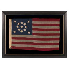 13 STAR ANTIQUE AMERICAN FLAG WITH A BEAUTIFUL MEDALLION CONFIGURATION OF STARS; A SMALL-SCALE EXAMPLE, MADE CIRCA 1895-1926