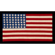 48 STARS ON A CROCHETED AMERICAN FLAG, PROBABLY MADE IN THE PATRIOTISM OF WWII (U.S. INVOLVEMENT 1941-1945), A BEAUTIFUL EXAMPLE, WITH LARGE, WELL-EXECUTED STARS AND STRIKING COLORS