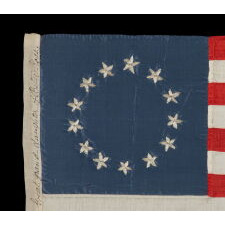 13 HAND-EMBROIDERED STARS AND EXPERTLY HAND-SEWN STRIPES ON AN ANTIQUE AMERICAN FLAG MADE IN PHILADELPHIA BY SARAH M. WILSON, GREAT-GRANDDAUGHTER OF BETSY ROSS, SIGNED & DATED 1910; THE LARGEST KNOWN EXAMPLE OF THIS VARIETY, MADE AND SOLD TO TOURISTS AT INDEPENDENCE HALL