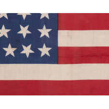 44 STARS IN JUSTIFIED ROWS, WITH VARIED STAR POSITIONING, ON A SILK, ANTIQUE AMERICAN FLAG WITH STRIKING COLORS, REFLECTS WYOMING STATEHOOD, circa 1890-1896