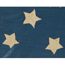 34 STARS ON A HOMEMADE ANTIQUE AMERICAN FLAG OF THE CIVIL WAR ERA, WITH A CORNFLOWER BLUE CANTON AND A VERY INTERESTING CONFIGURATION THAT SUBTLY INCORPORATES THE CROSSES OF ST. ANDREW AND ST. GEORGE, REFLECTS KANSAS STATEHOOD, 1861-63