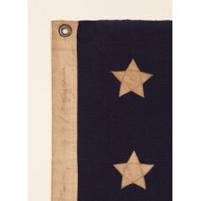 13 STARS WITH SHORT, CONICAL ARMS ON A SMALL SCALE, ANTIQUE AMERICAN FLAG MADE DURING THE LAST DECADE F THE 19TH CENTURY; POSSIBLY OF PHILADELPHIA ORIGIN; FORMERLY IN THE COLLECTION OF BOLESLAW & MARIE D'OTRANGE MASTAI, THE FIRST MAJOR COLLECTORS TO PUBLISH A PICTORIAL REFERENCE (KNOPF, NEW YORK, 1973):