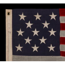 13 STAR ANTIQUE AMERICAN FLAG WITH A 3-2-3-2-3 CONFIGURATION OF STARS ON AN INDIGO CANTON, SQUARISH PROPORTIONS, AND A BEAUTIFUL OVERALL PRESENTATION, MADE circa 1895-1926