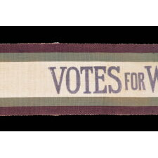 FULL, WRAP-AROUND, SILK SUFFRAGETTE SASH IN VIOLET & GREEN, WITH "VOTES FOR WOMEN" TEXT, DESIGNED BY SYLVIA PANKHURST FOR THE WOMEN’S SOCIAL & POLITICAL UNION (U.K.), PRODUCED BY TOYE &. COMPANY OF BIRMINGHAM, CIRCA 1908