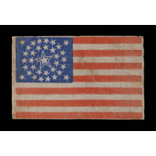 34 STARS IN A MEDALLION CONFIGURATION ON AN ANTIQUE AMERICAN PARADE FLAG WITH A LARGE, HALOED CENTER STAR; CIVIL WAR PERIOD, KANSAS STATEHOOD, 1861-1863