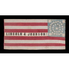 ONE OF THE TWO BEST OF ALL KNOWN FLAGS ADVERTISING ABRAHAM LINCOLN’S 1864 INCUMBENT PRESIDENTIAL CAMPAIGN FOR THE WHITE HOUSE, WITH VICE PRESIDENTIAL RUNNING MATE ANDREW JOHNSON; ENTIRELY HAND-SEWN, WITH A DOUBLE-WREATH CONFIGURATION OF 34 STARS, IN THREE DIFFERENT SIZES, THAT FEATURES HUGE STARS IN EACH CORNER, WITH 9 STRIPES AND WITH ITS CANTON RESTING ON THE WAR STRIPE, BOLD LETTERING , AND IN AN IDEAL SCALE AMONG ALL FLAGS OF THIS ERA