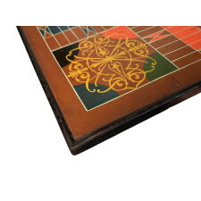 7-COLOR, CARRIAGE-PAINTED, AMERICAN PARCHEESI GAMEBOARD WITH A SPANISH BROWN / TOMATO RED GROUND AND FANCIFUL SCROLLWORK MEDALLIONS, circa 1875