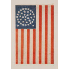 38 STARS IN A MEDALLION CONFIGURATION WITH 2 OUTLIERS, ON AN ANTIQUE AMERICAN FLAG WITH VIBRANT COLORATION, REFLECTS COLORADO STATEHOOD, 1876-1889, ILLUSTRATED IN “THE STARS & STRIPES: FABRIC OF THE AMERICAN SPIRIT” by RICHARD PIERCE, 2005
