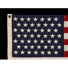 49 STAR AMERICAN FLAG IN A SMALL SCALE AMONG ITS COUNTERPARTS WITH PIECED AND SEWN CONSTRUCTION, REFLECTS THE ADDITION OF ALASKA IN 1959, OFFICIAL FOR JUST ONE YEAR; EXHIBITED JUNE-SEPTEMBER, 2021 AT THE MUSEUM OF THE AMERICAN REVOLUTION
