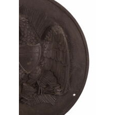 AMERICAN, PRE-CIVIL WAR, CAST IRON MEDALLION / PLAQUE WITH A FEDERAL EAGLE SUPERIMPOSED ON A SUNBURST, DATED 1857
